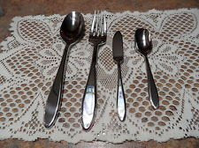 Claremont 4- Piece Hostess Set. consists of a big spoon, meat fork, butter knife and, sugar spoon.